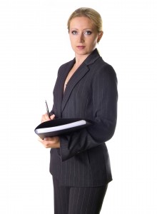 woman in suit talking about resumes